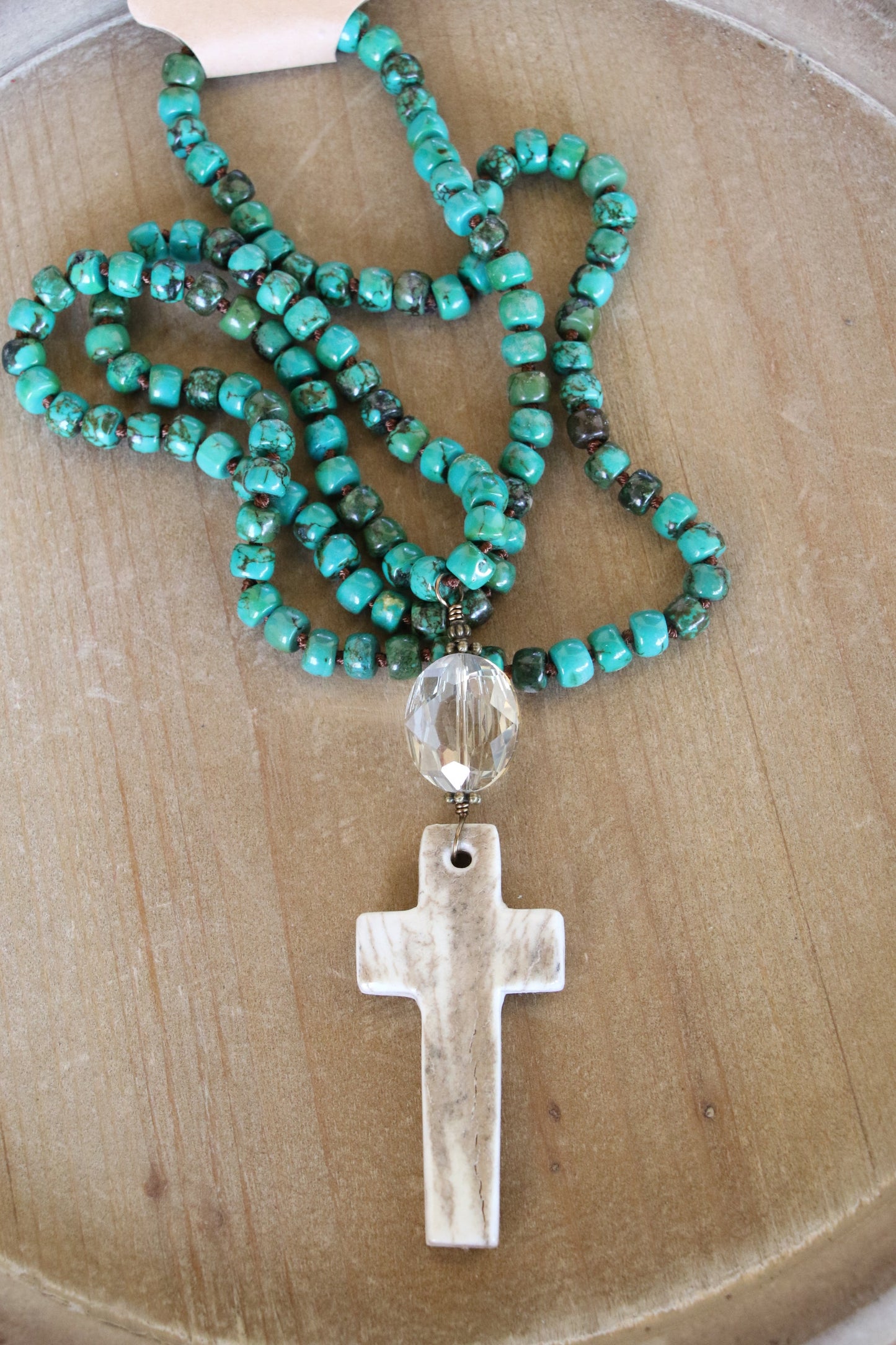 TURQUOISE CYLINDER THREADED W/ CARVED ANTLER CROSS PENDANT